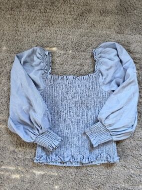 Cupcakes and Cashmere smocked periwinkle blue blouse. Size M.
